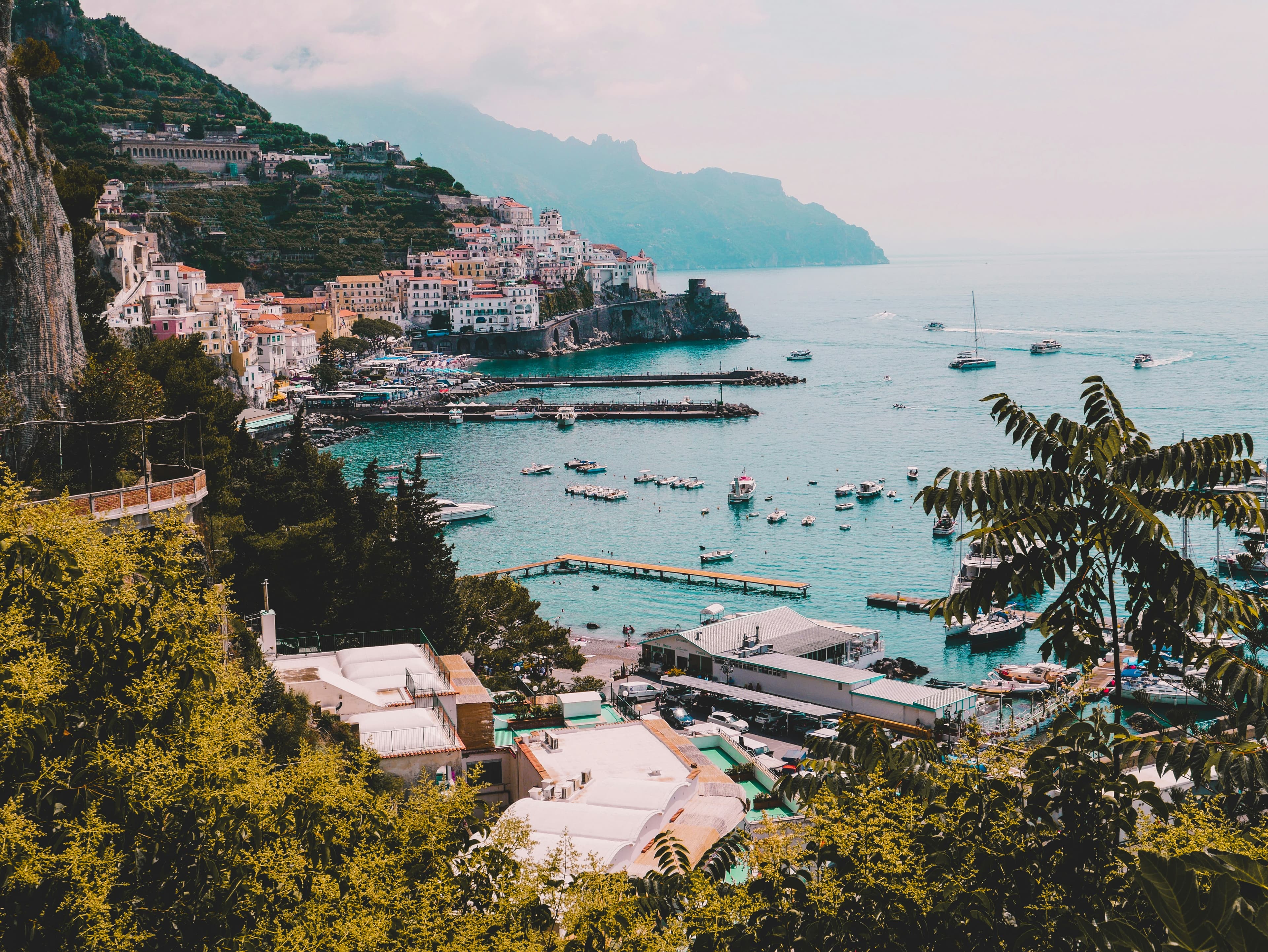 A village of pale houses stacked above the sea on the Amalfi Coast