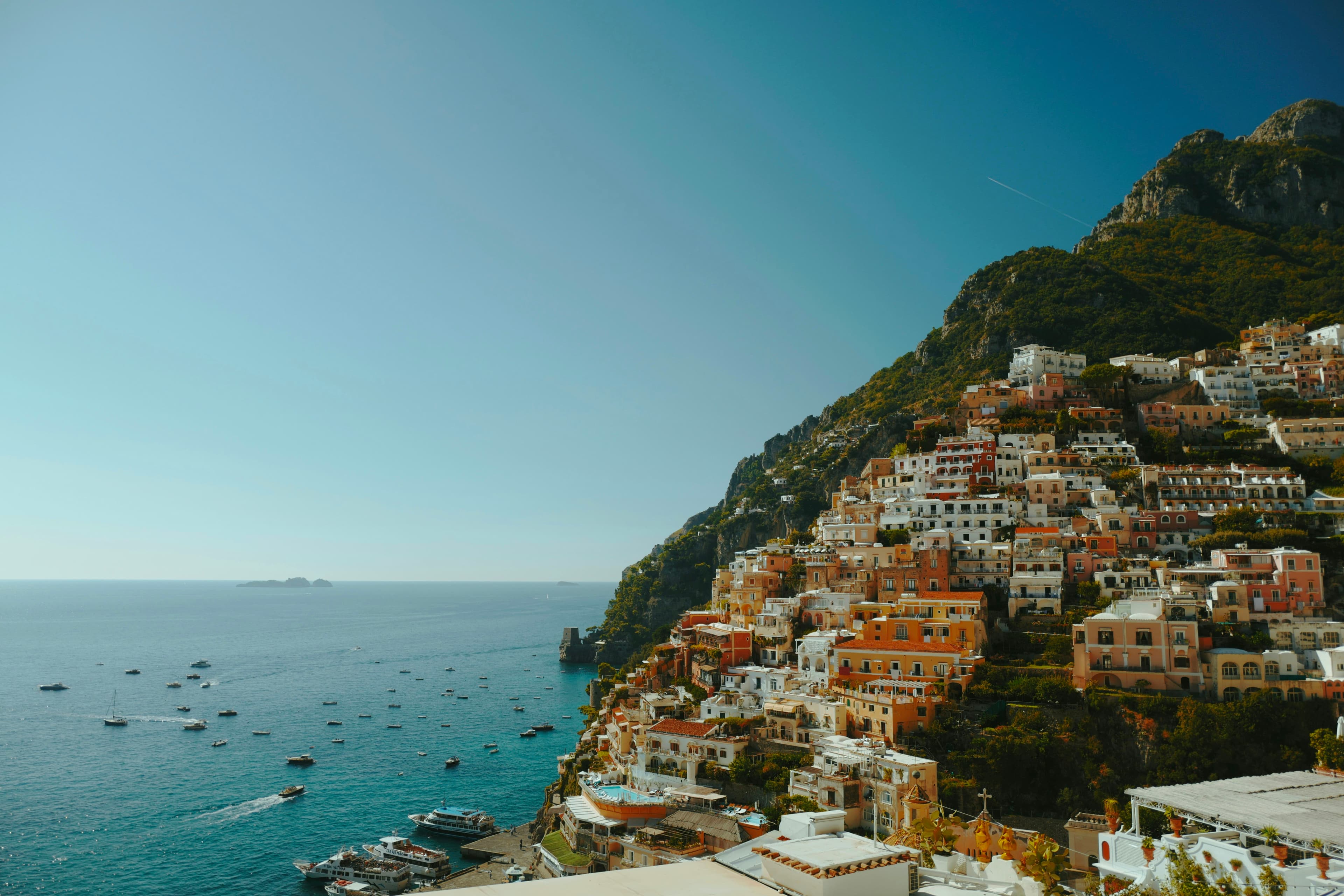 A village stacked on the cliff above the Bay of Praiavella, Amalfi Coast, Italy